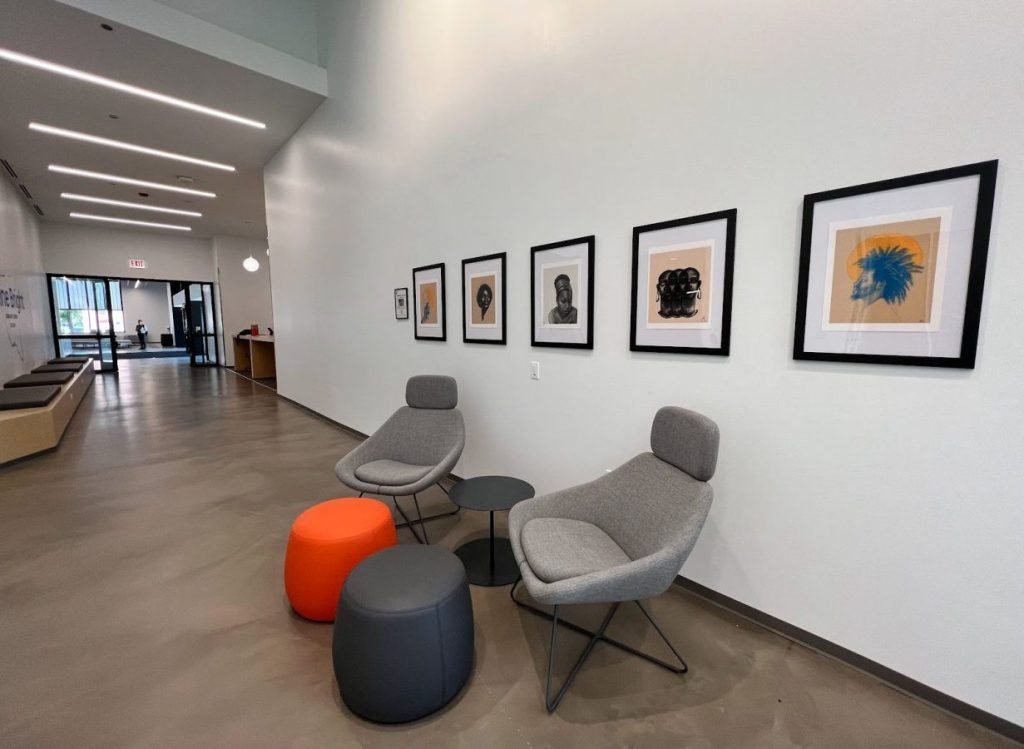 Corporate Art - a stylish office aiting area with 4 eye catching framed pieces of Artwork that give the space characater and style